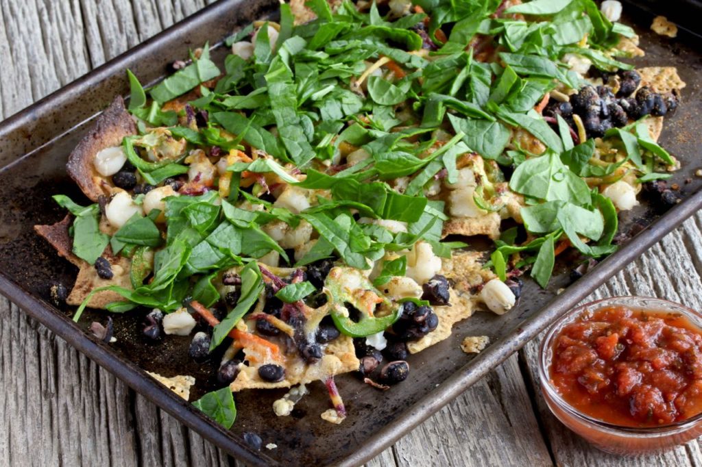 Make these Veggie Loaded Nachos your favorite, nourishing go-to meal! @cookinRD | sarahaasrdn.com