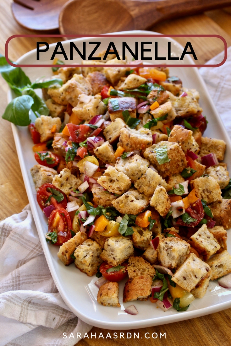 Panzanella, a delightful bread salad made with chewy whole grain baguette tossed with fresh tomatoes, basil and a simple vinaigrette. @cookinRD | sarahaasrdn.com