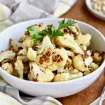 You've had roasted cauliflower, but you haven't had THIS roasted cauliflower! Yummy, caramelized cauliflower is topped with a lemon-tahini drizzle. 'Nuf said. @cookinRD | sarahaasrdn.com