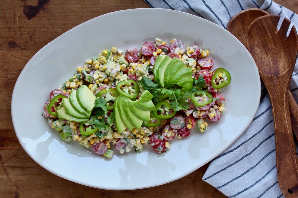 Grilled sweet corn becomes salad! Add a little avocado and jalapeno and a super tasty dressing and you've got a salad you will happily enjoy all summer!