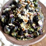 The perfect side dish to any holiday meal! These Roasted Brussels Sprouts are festively topped with dried cherries, toasted pumpkin seeds and balsamic reduction! @cookinRD | sarahaasrdn.com
